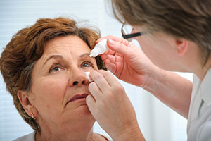 Patient getting eyedrops