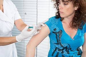 Woman getting an injection